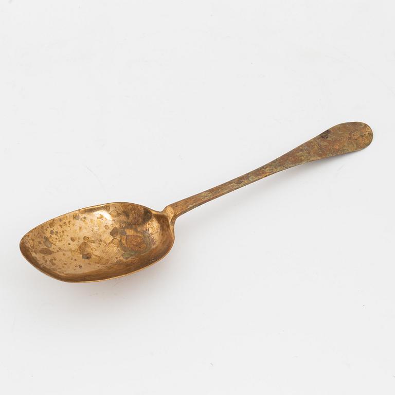 A brass basting spoon, circa 1800.