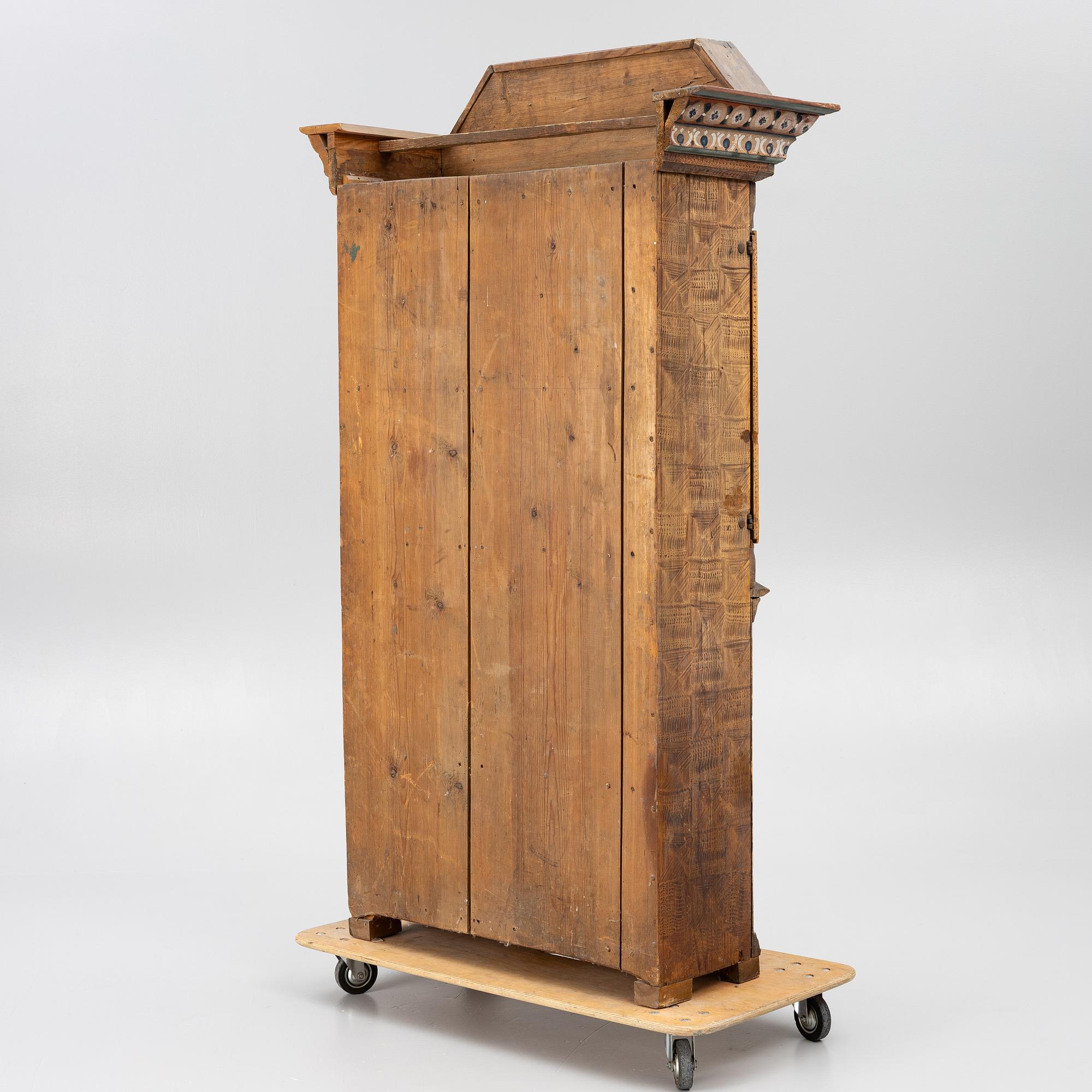 A Swedish Dalecarlian folk art cabinet dated 1808.