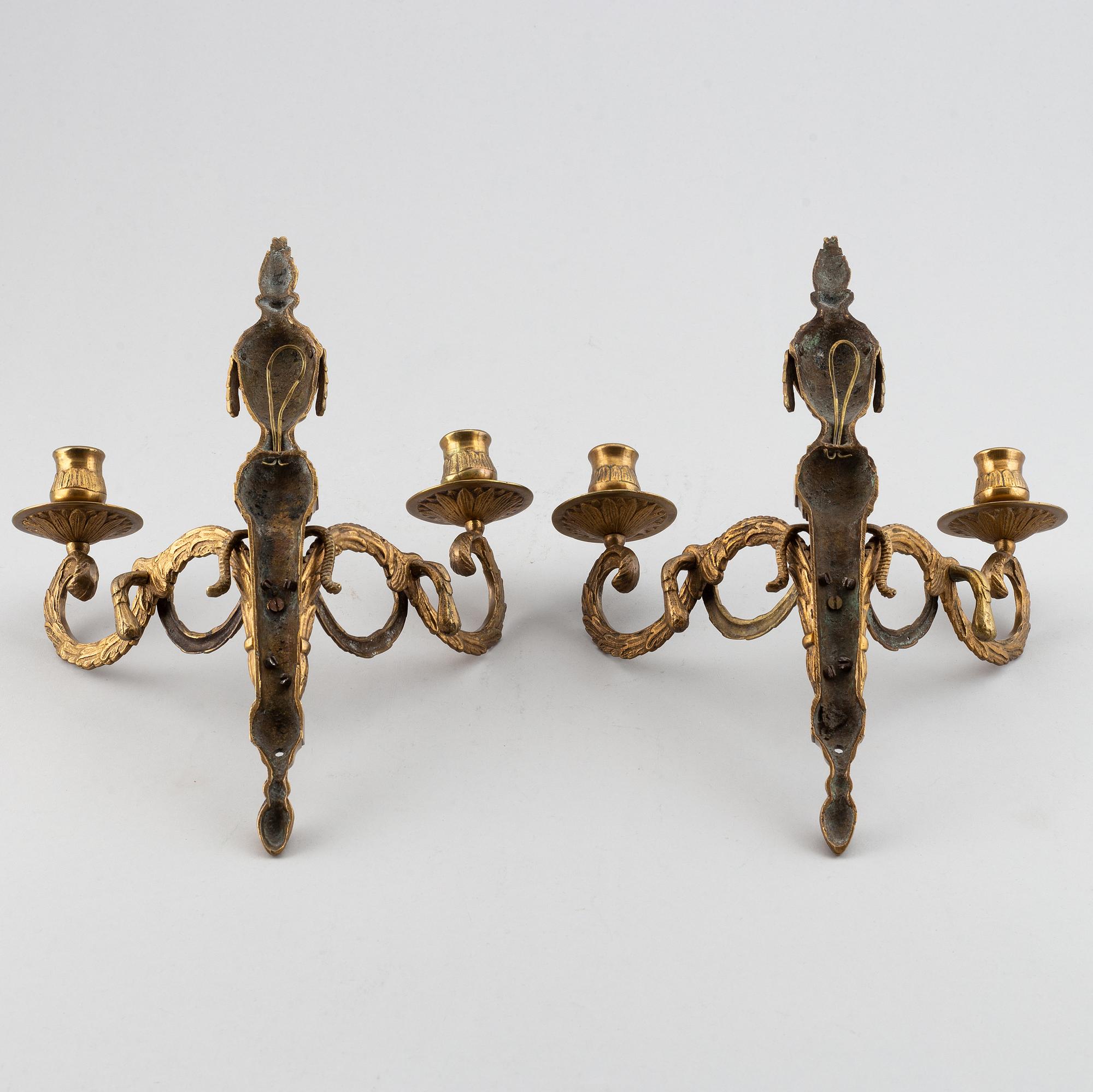 A 20th Century pair of Louis XVI style wall sconces, for two candles.