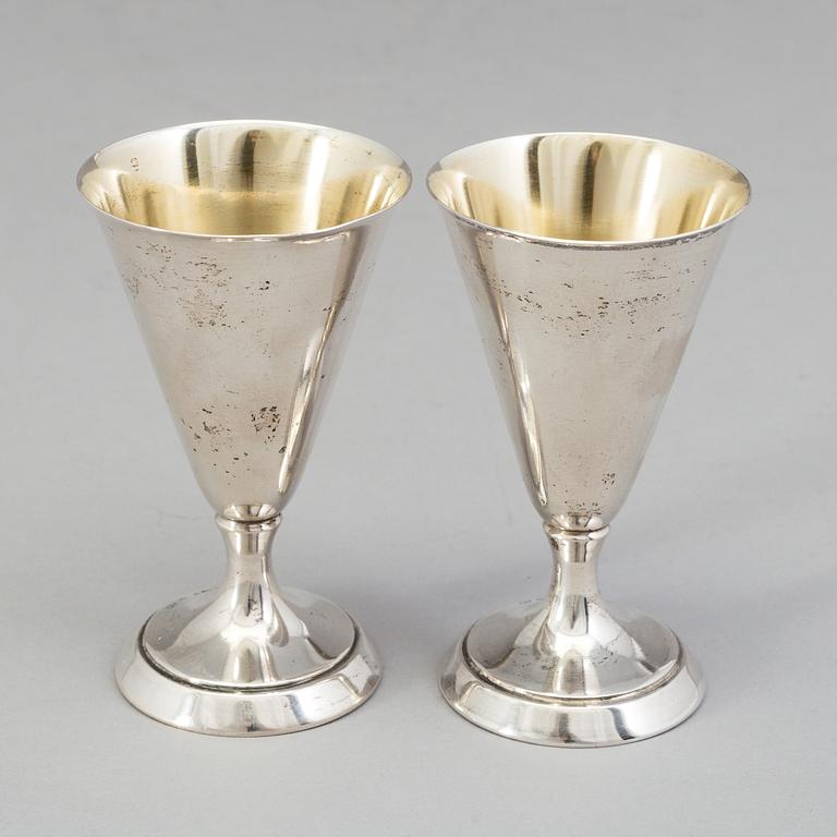 a set of twelve silver drinking cups from around 1936. Weight 175 g.