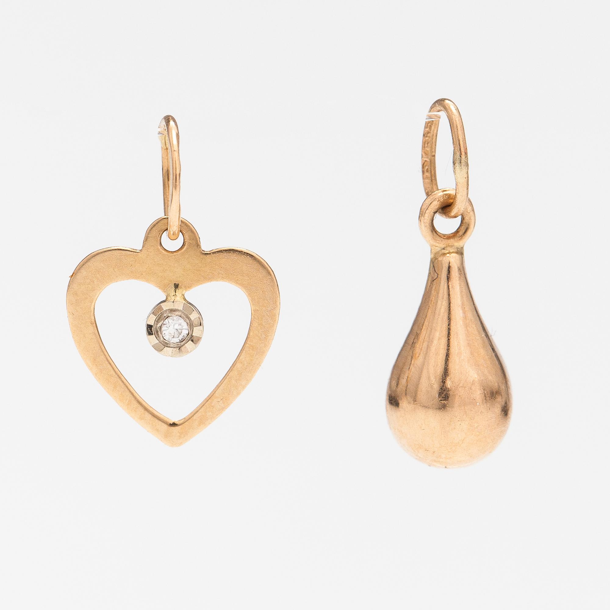 Two 14K gold pendants one with a diamond ca. 0.0025 ct.