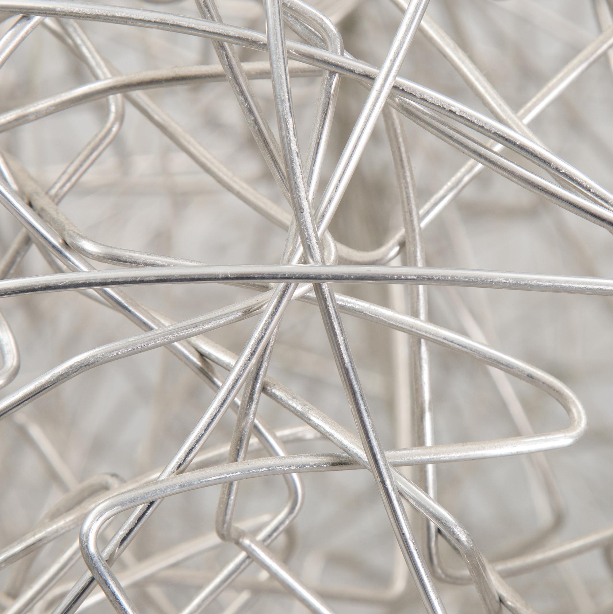 A 'Fil de Fer Ovale' ceiling light by Enzo Cattelini.