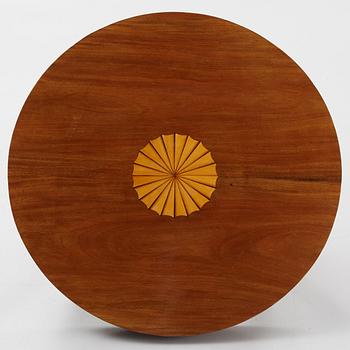 A mahogany veneered Empire style table, first half the 20th Century.