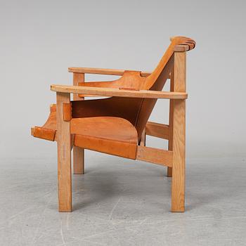 CARL-AXEL ACKING, an oak and leather 'Trienna' easy chair from Källemo.