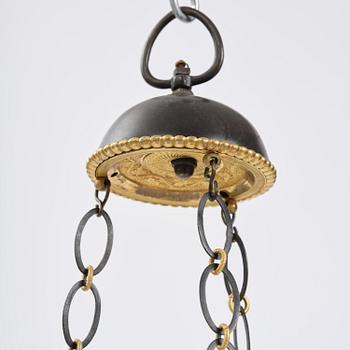 A patinated and ormolu six-light Empire chandelier, Stockholm, first part 19th century.