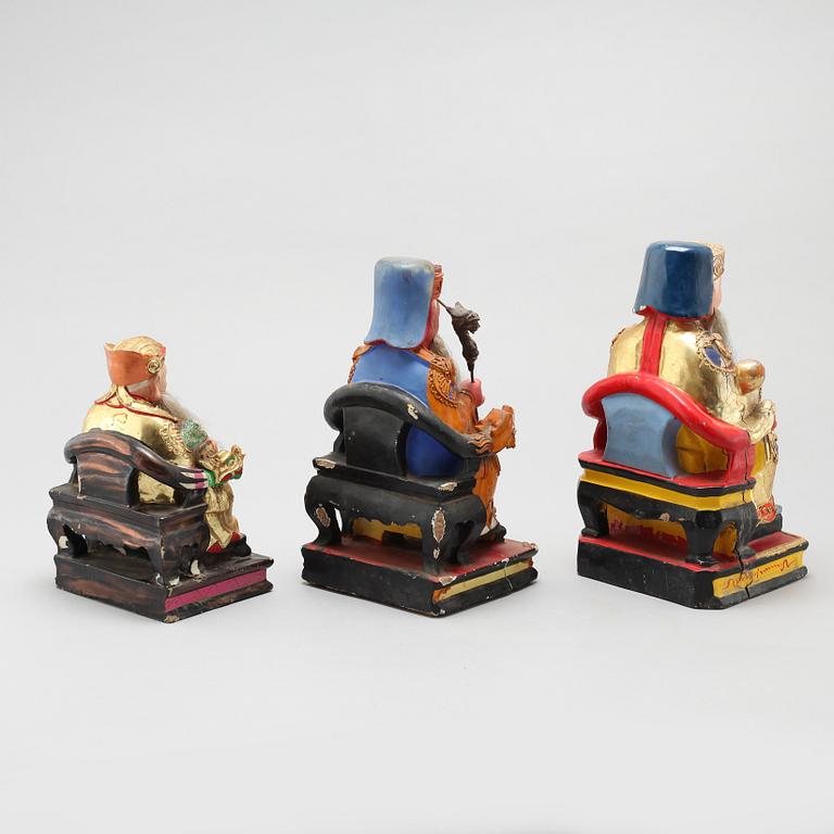 A set of three wooden deities, China, early 20th Century.