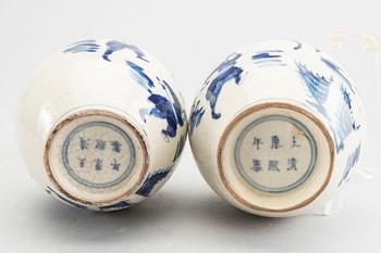 A set of two pairs of Kangxi and Kangxi style blue and white porcelain vases.