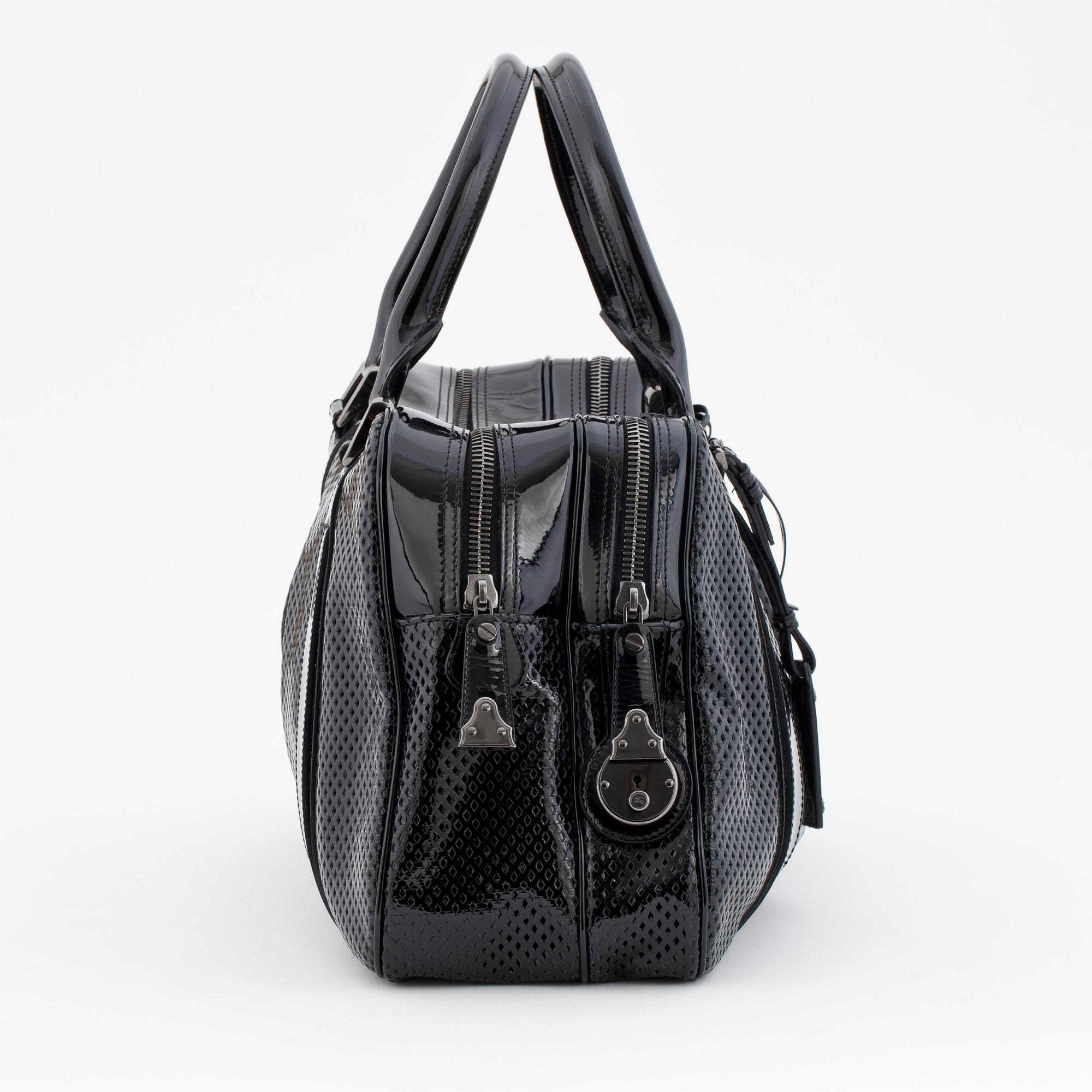 BURBERRY, a black patent leather bag.