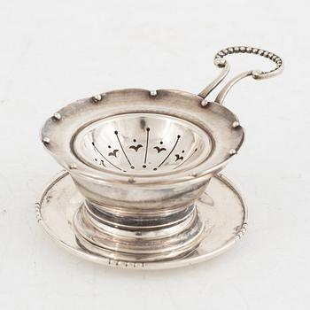 Tea strainer with bowl, sterling silver, Georg Jensen, Copenhagen 1933-1944+tray, silver, Jörgen Jensen, Stockholm 1924.