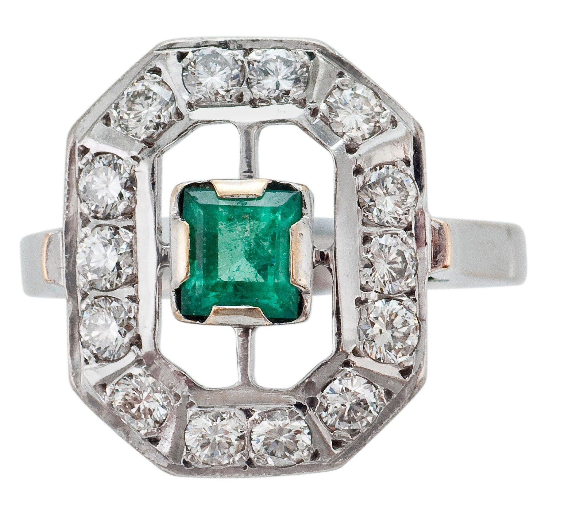 A RING, emerald c. 0.55 ct and diamonds c. 0.70 ct.