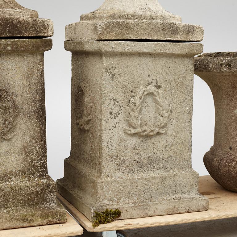 Garden urns, a pair on pedestals, 20th century.