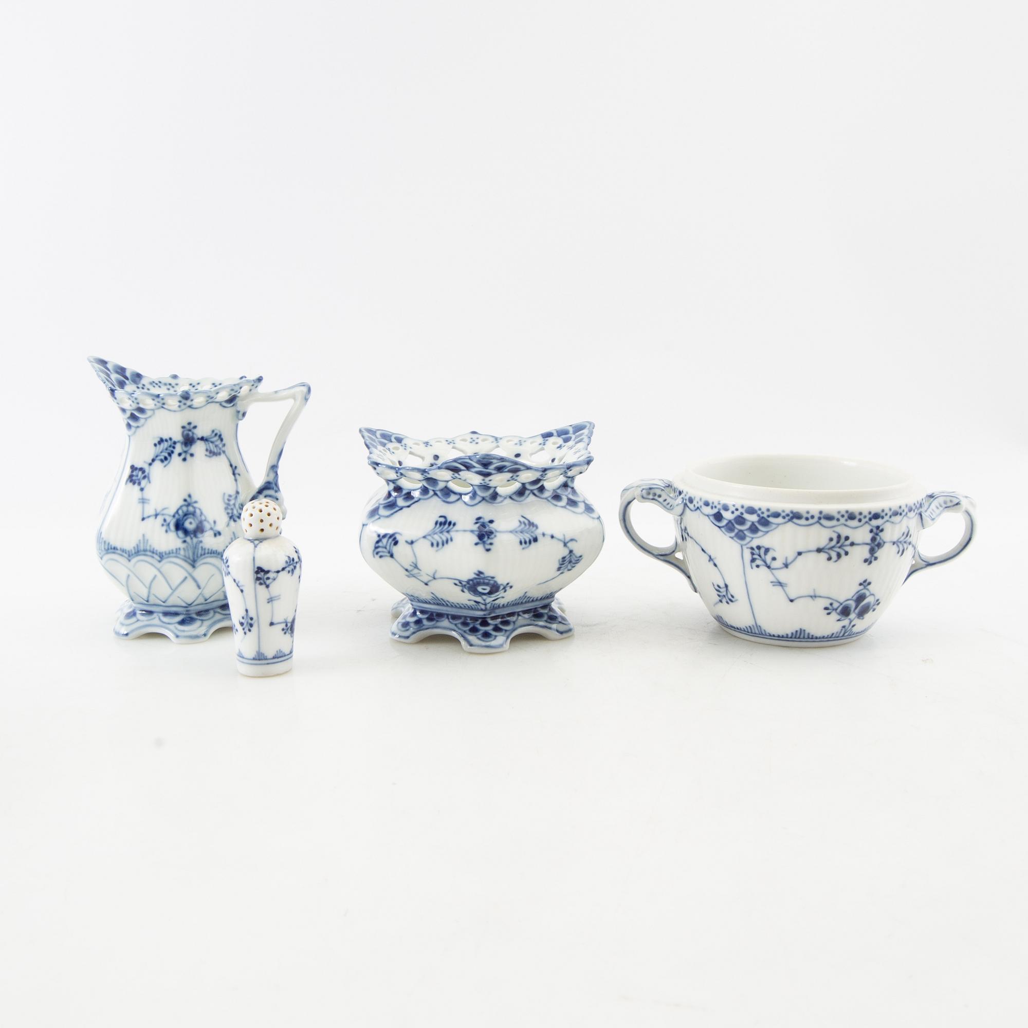 Service pieces 9 pcs "Musselmalet" mostly full lace Royal Copenhagen Denmark 20th century porcelain.