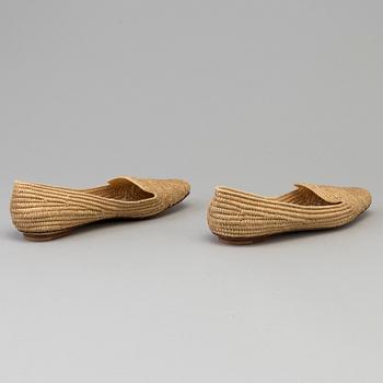 A pair of raffia shoes by Emma Hope's.