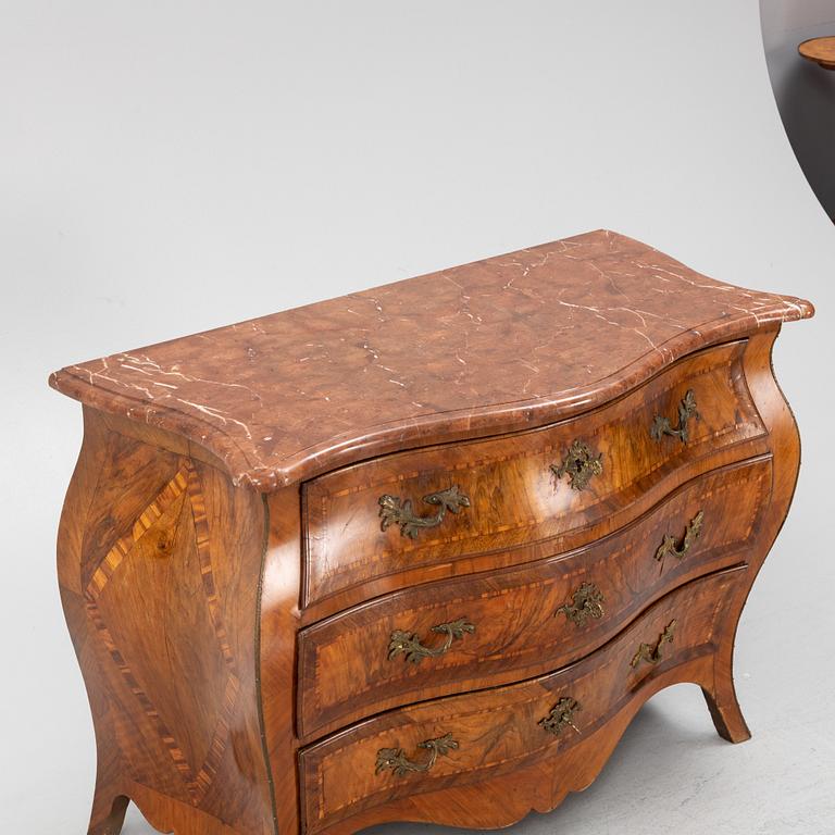 A rococo chest of drawers, mid 18th Century.