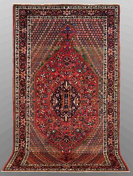 A carpet, Semi-antique Baktiari, ca 303 x 170 cm.