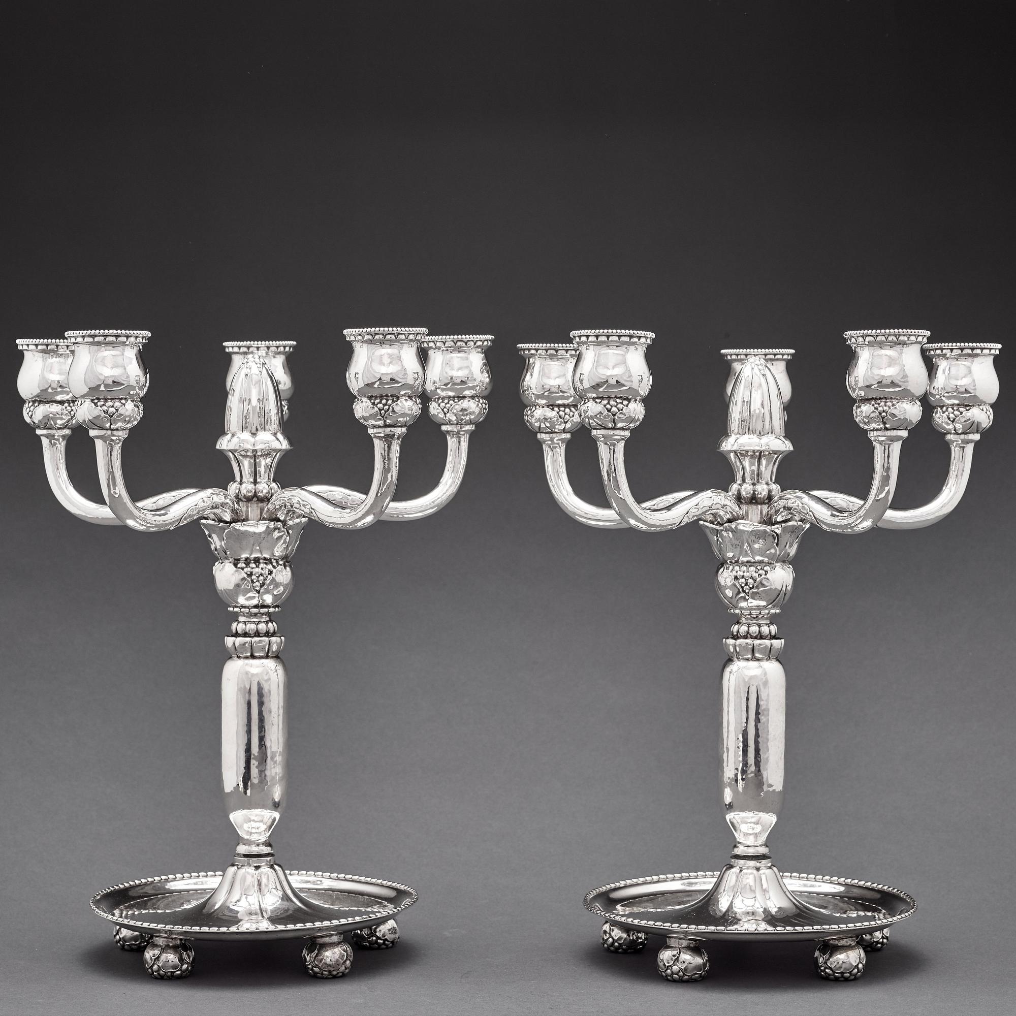 Georg Jensen, a pair of 830/1000 silver five light candelabra, Copenhagen 1920, design nr 200.
