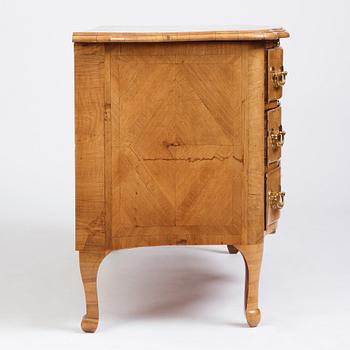 A late Baroque walnut-veneered chest of drawers attributed to J. H. Fürloh (master in Stockholm 1724-1745).