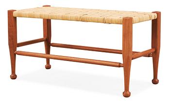 A Josef Frank mahogany and rattan bench, Svenskt Tenn, model 2009.