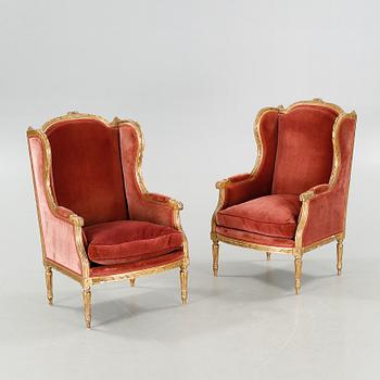 A pair of lounge chairs from the first half of the 20th century.