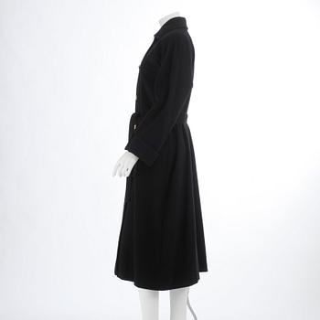 CÉLINE, a black cashmere and wool coat.