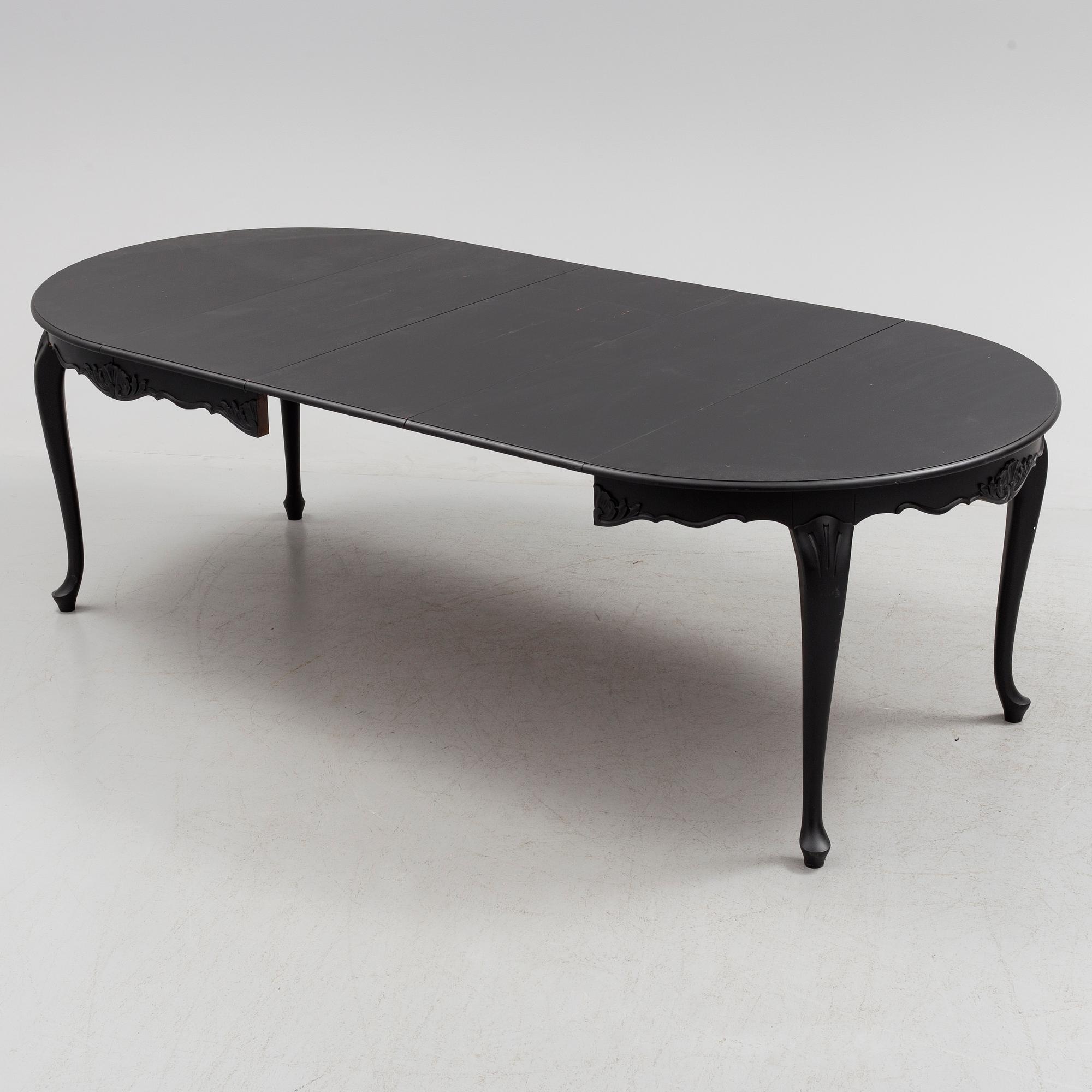 A mid 20th century rococo style dining table.