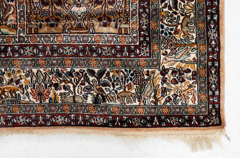 An oriental silk carpet, c. 305 x 205 cm.