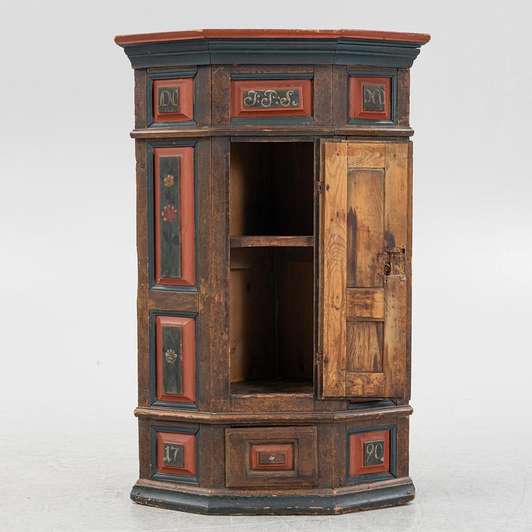 A Swedish provincial corner cabinet, dated 1790.