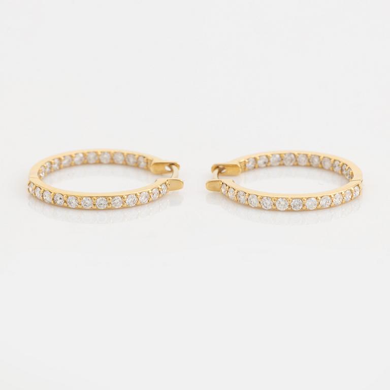 Brilliant cut diamond hoop earrings.