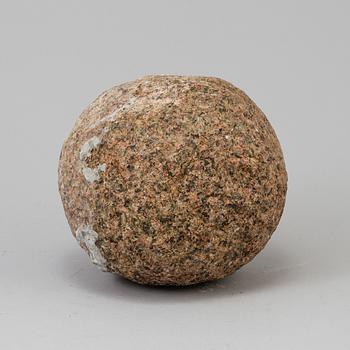 A GRANITE CANNON BALL, possibly 18th century.