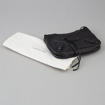 A black alligator printed leather "Classic hip" bag by Balenciaga.