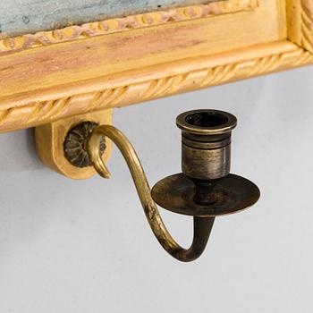 A pair of mirrored wall sconces from the latter half of the 20th century.