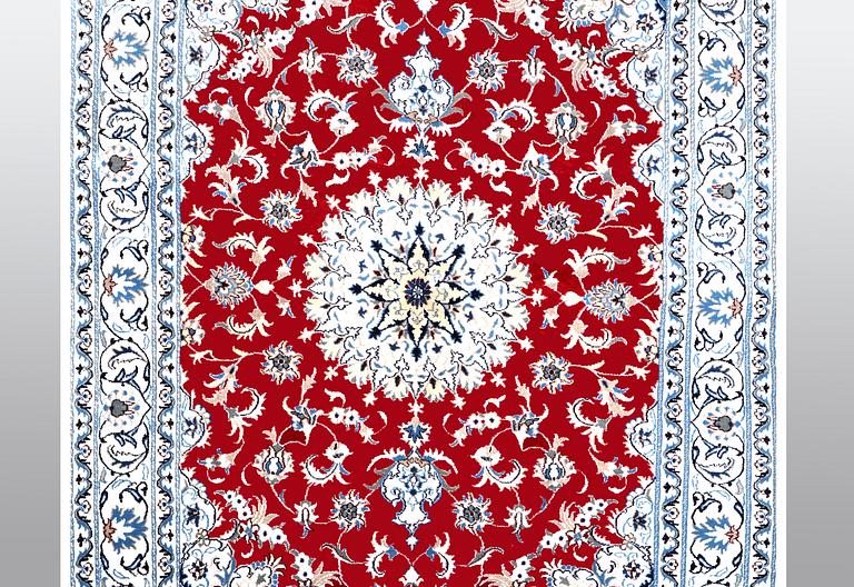 A carpet, Nain, part silk, ca 238 x 170 cm.