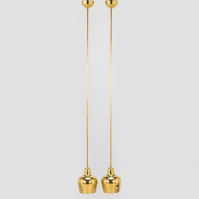 Paavo Tynell, a pair of mid 20th century ceiling lights, model 1699, for Taito / Idman.