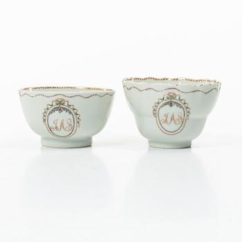 Cups and saucers, 11+7, and a teapot in famille rose with monogram, company porcelain, China, 18th century.