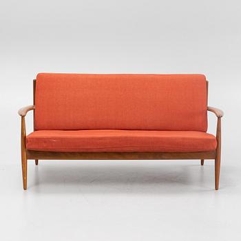 A sofa and easy chair by Grete Jalk from France & Daverkosen.