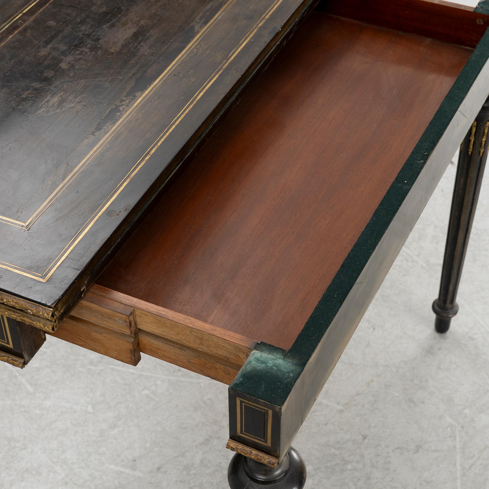 A Louis XVI style games table, circa 1900.