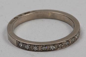 RING, 18 K vitguld och briljanter, 11 st, tot ca 0.55 ct. Erik Thomassons, Stockholm (1954? otydl stmpl).