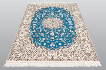 A rug, Nain part silk s.k 6LAA, ca 237 x 157 cm.