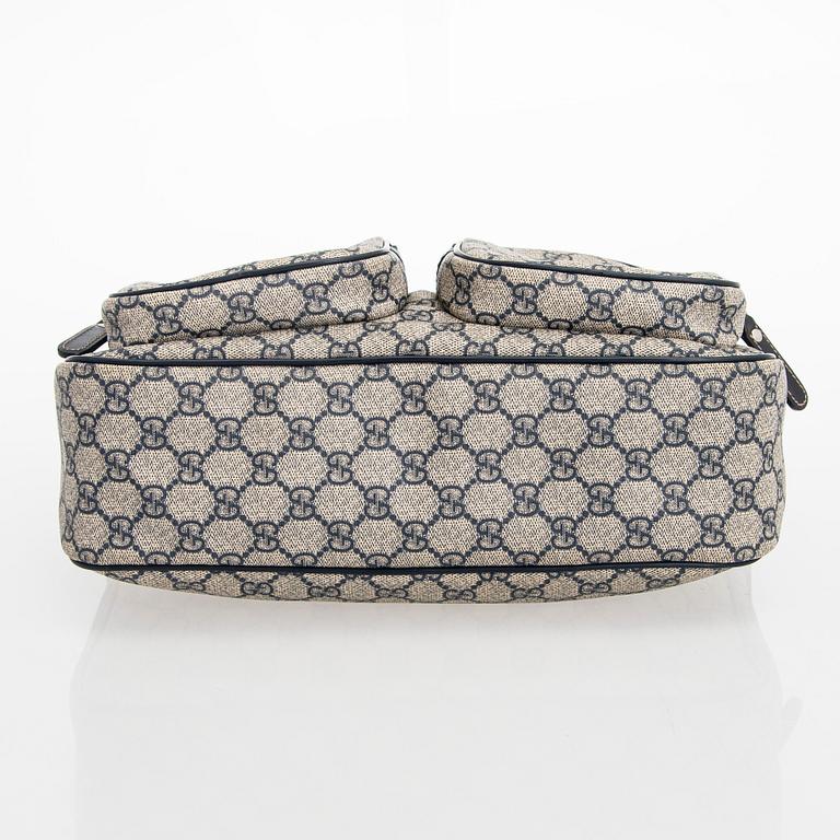 Gucci, A "GG Supreme messenger" bag.