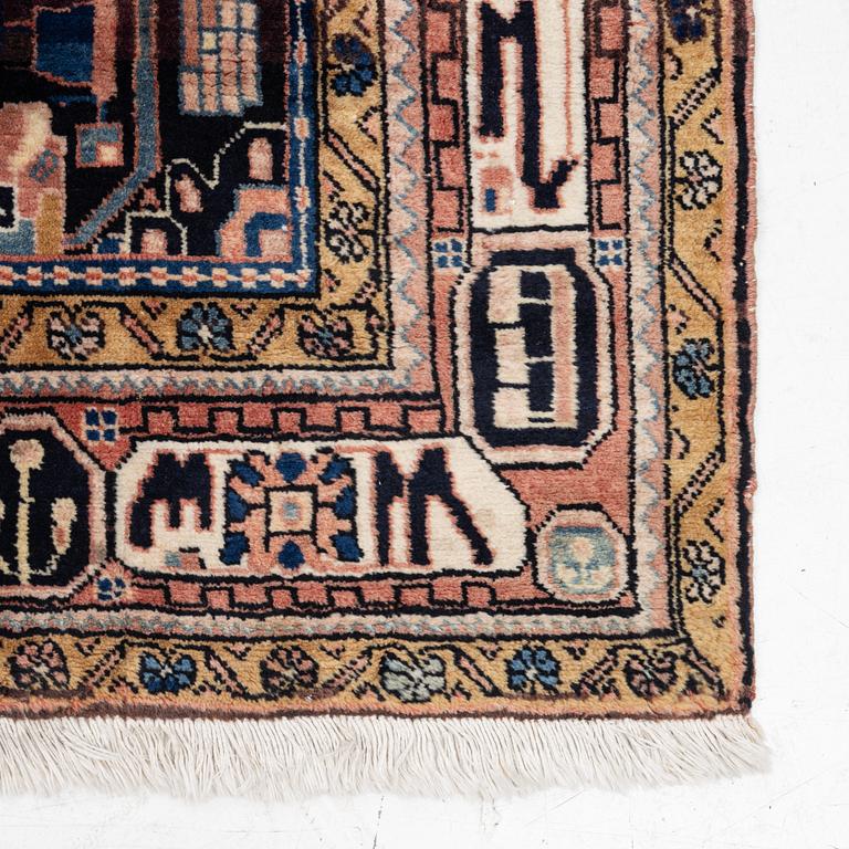 An oriental rug, c. 300 x 155 cm.