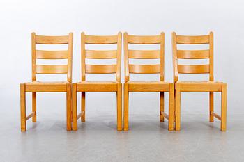 A set of four wicker and oak 1970s chairs.
