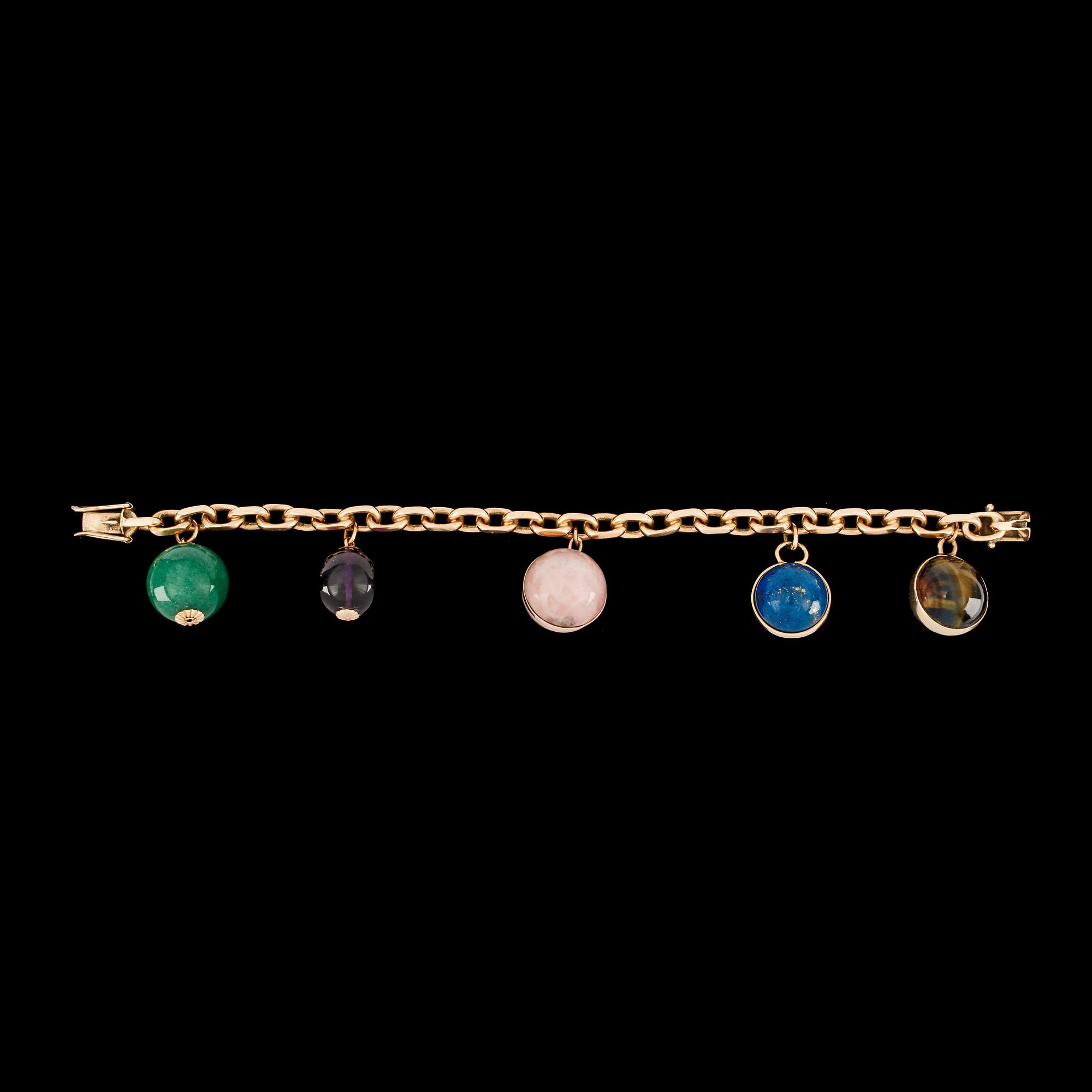 A charm bracelet. Total weight 74 g.