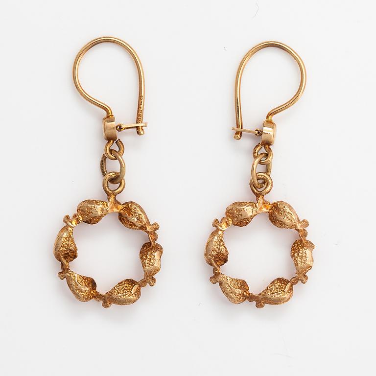 A pair of 14K gold earrings.