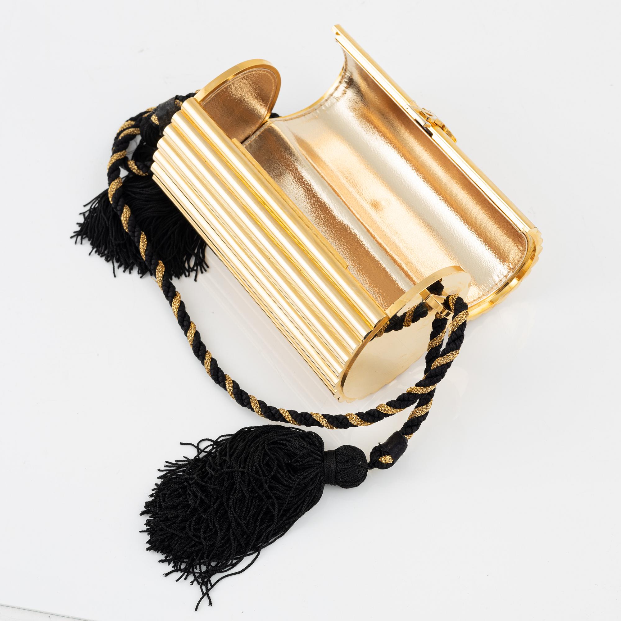 Yves Saint Laurent a Minaudiere Opium evening bag vintage. Bukowskis