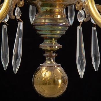 A brass chandelair, around the year 1900.