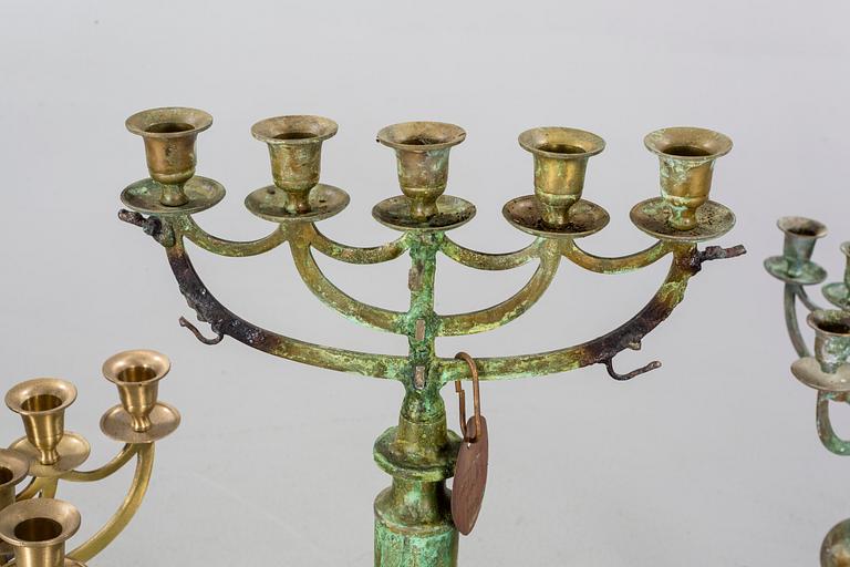 a metal sculpture group in eight parts, partly signed.