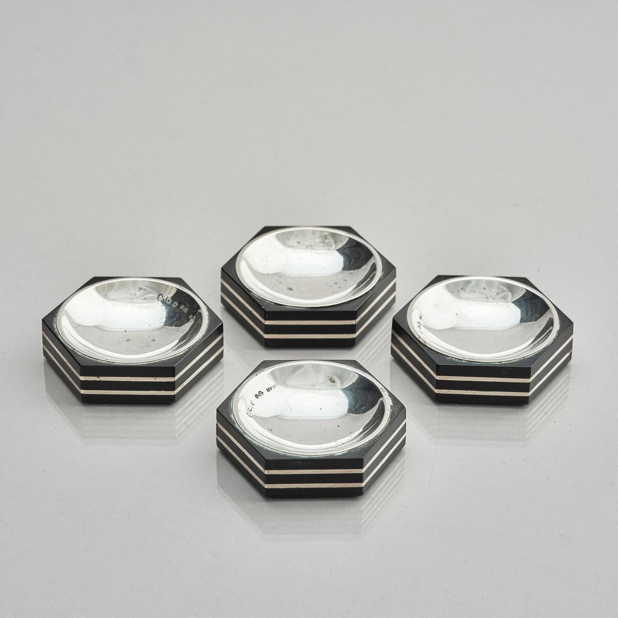 Guldsmedsaktiebolaget (GAB), four silver and bakelite salt-cellars, design by Eric Pihlgren, Stockholm, Sweden 1938.