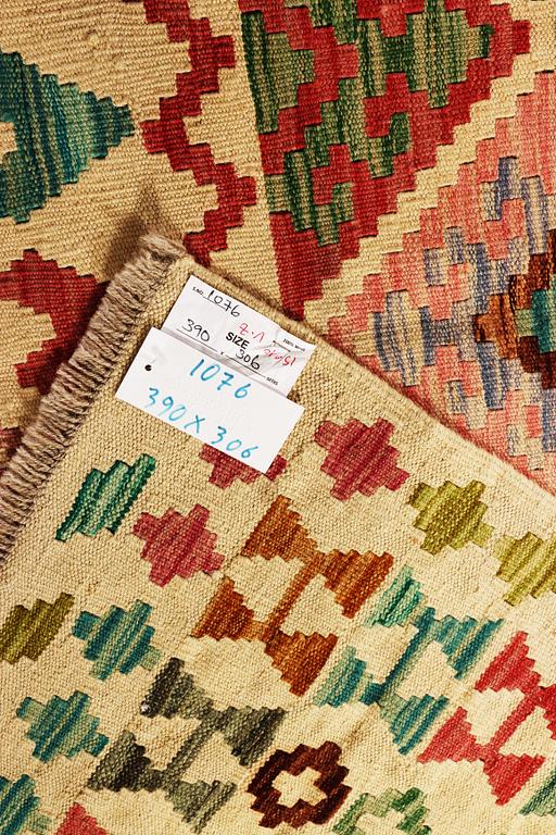 A Kilim carpet, c. 390 x 306 cm.
