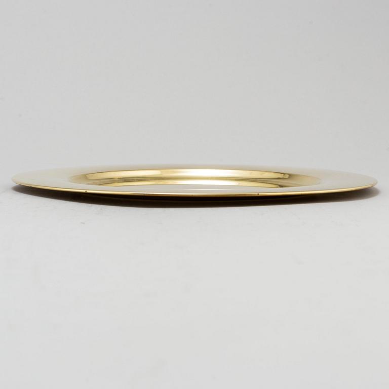Eight brass plates by Stelton, Denmark, second half of the 20th century.