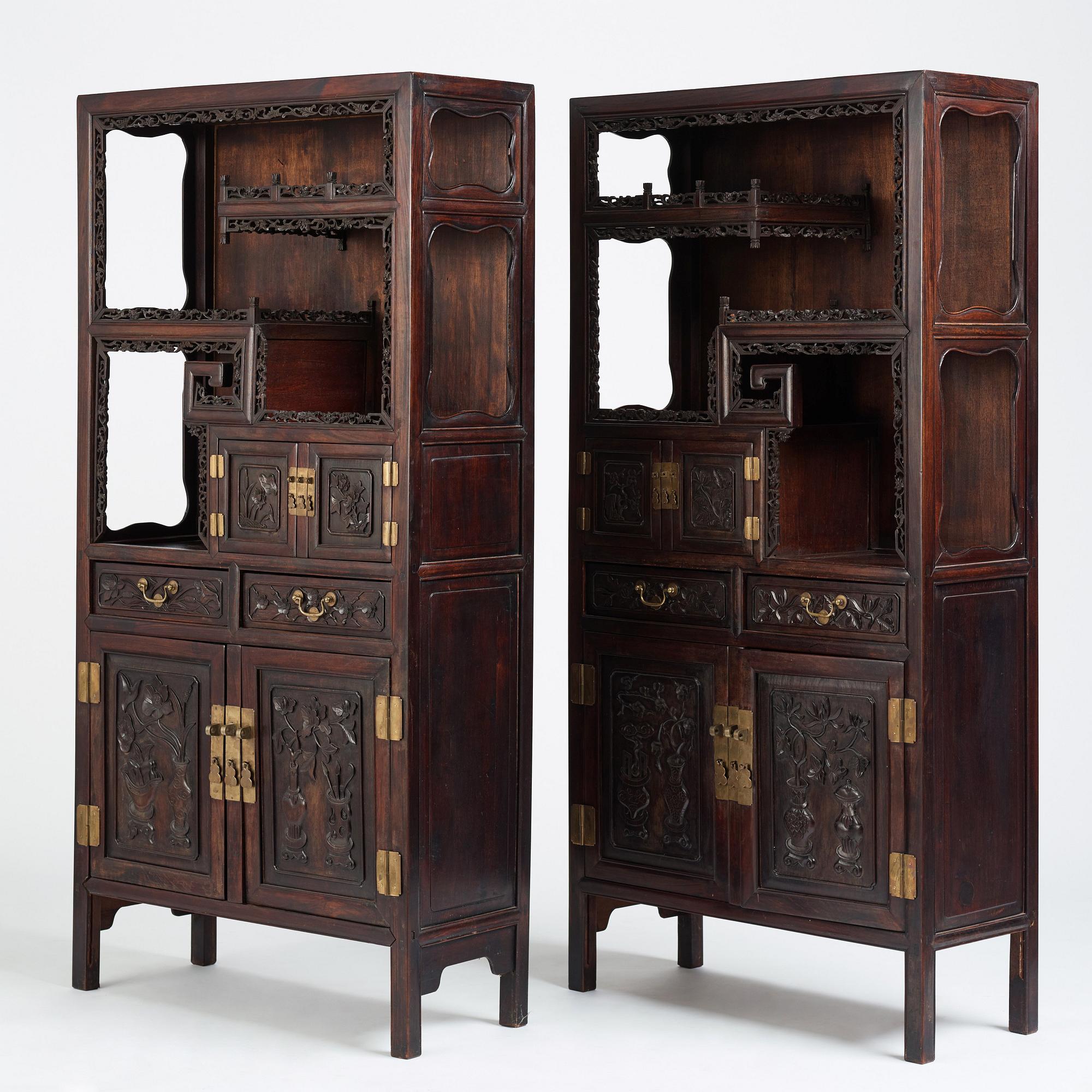 A pair of Chinese hardwood display cabinets, Qing dynasty, 19th Century.
